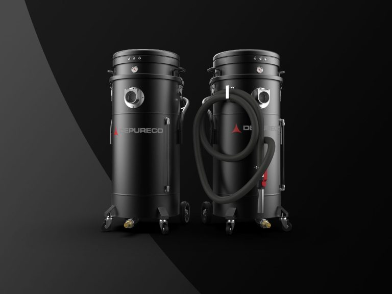 Two Depureco industrial liquid vacuums on casters; one with coiled hose; black studio backdrop.